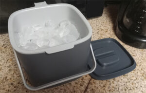 Hotel Room Ice Buckets - bin with ice on the kitchen countertop